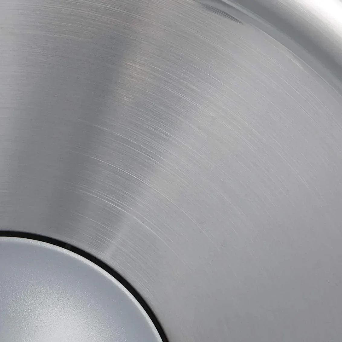 Stainless steel cookware with brushed finish for modern kitchen use