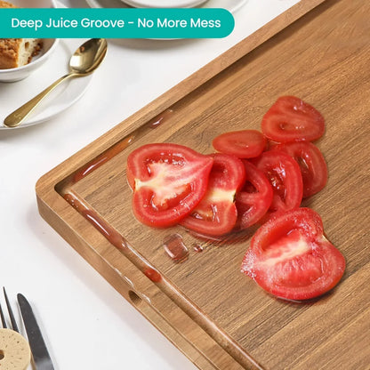Wood cutting board with deep juice groove holding sliced tomatoes, mess-free kitchen prep