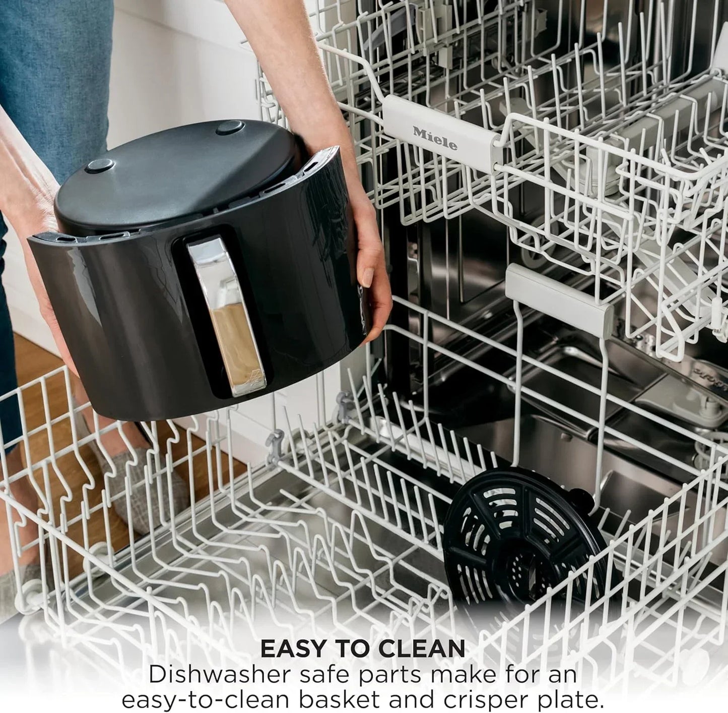 Dishwasher-safe air fryer basket and crisping plate for easy cleaning, shown with Miele dishwasher