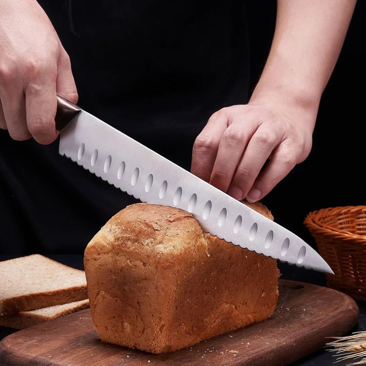 Slicing fresh bread with a serrated knife on a wooden cutting board