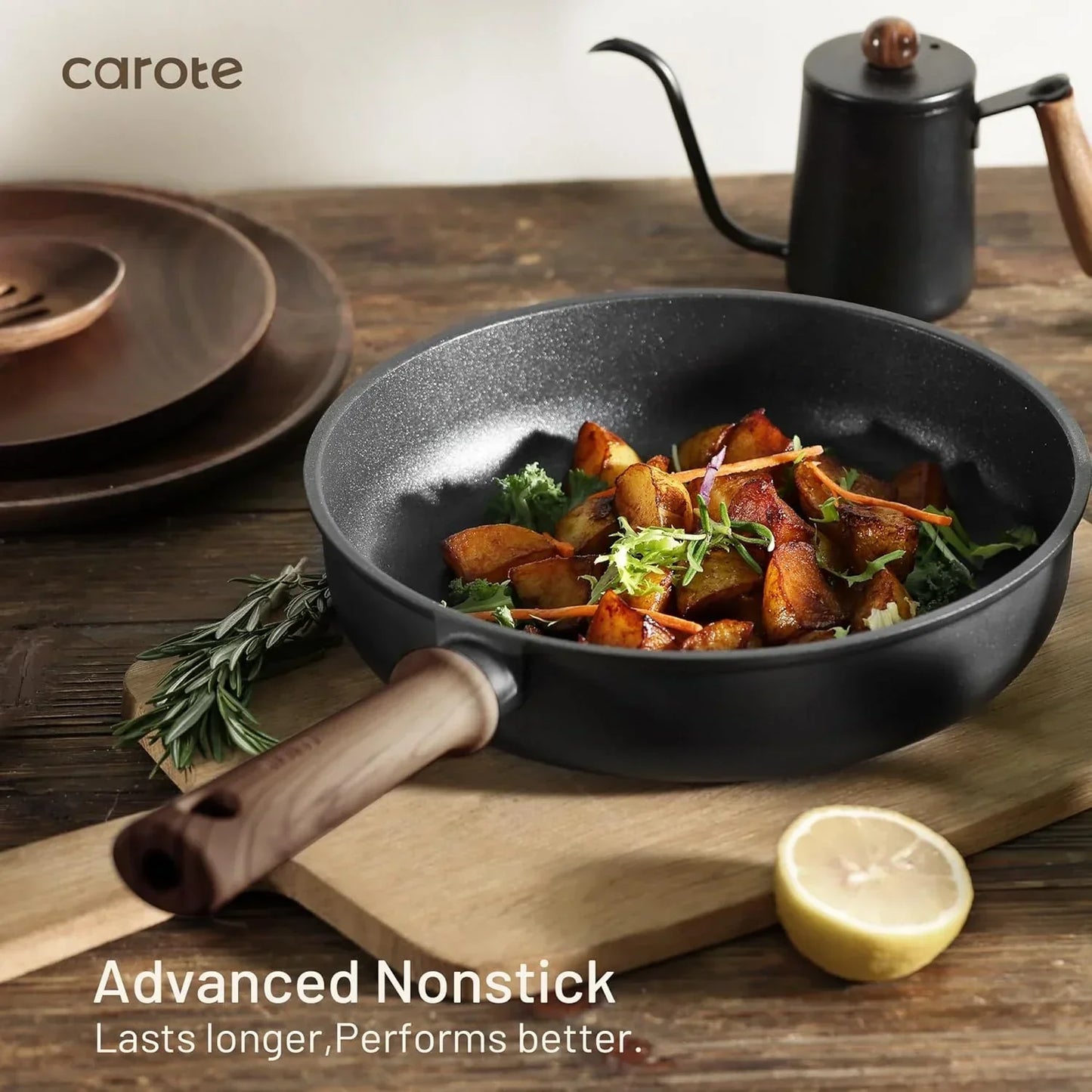 Black nonstick frying pan with roasted potatoes and herbs, wooden handle, on cutting board with lemon