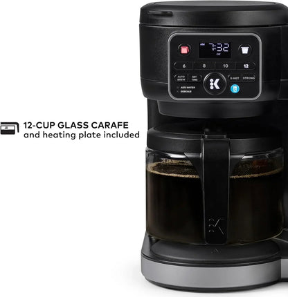 Black drip coffee maker with 12-cup glass carafe, digital display, and programmable brew settings for home kitchen use