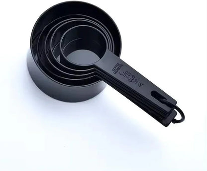 Black nested measuring cups set for baking and cooking, labeled with cup and ml measurements