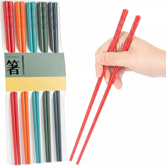 Colorful chopsticks set with red pair in hand, ideal for kitchen dining and serving