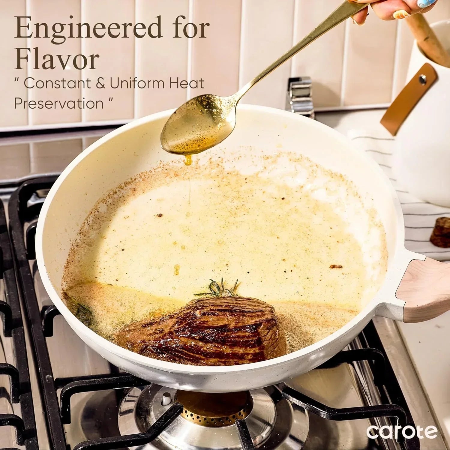 White nonstick frying pan on stove searing steak with sauce, kitchen cookware in use