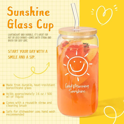 Sunshine glass cup with smiley sun design, bamboo lid, straw, and citrus-infused drink for morning refreshment