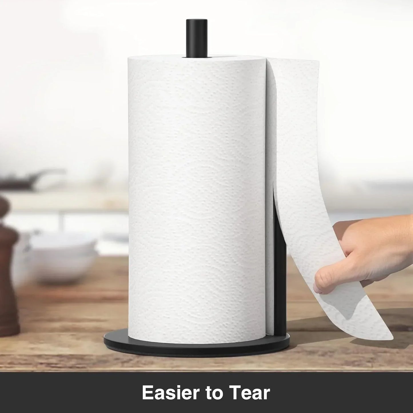 Black paper towel holder with easy-tear feature on wooden kitchen counter