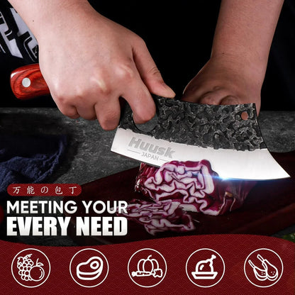 Hand using a Huusk Japan chef knife slicing red cabbage on a cutting board with kitchen tool icons.