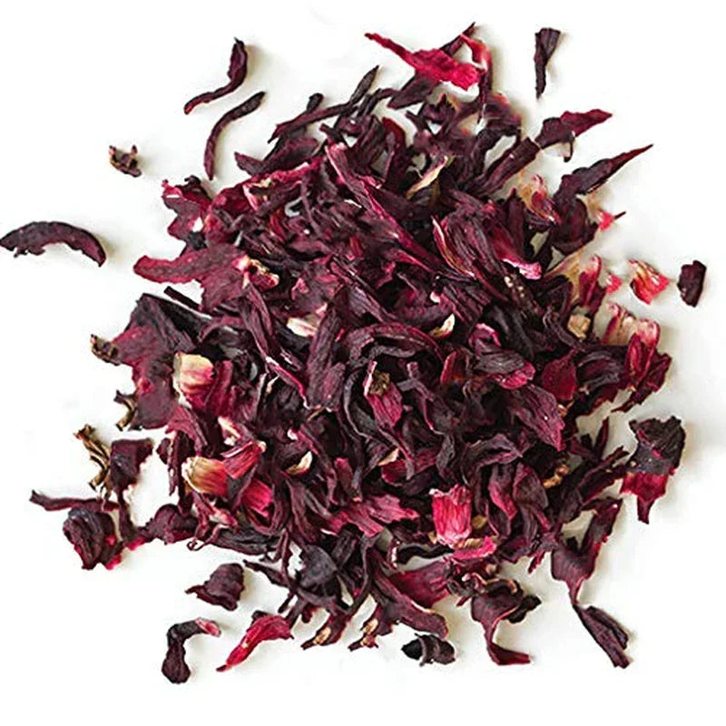 Dried hibiscus flowers for herbal tea and cooking, vibrant red petals on white background