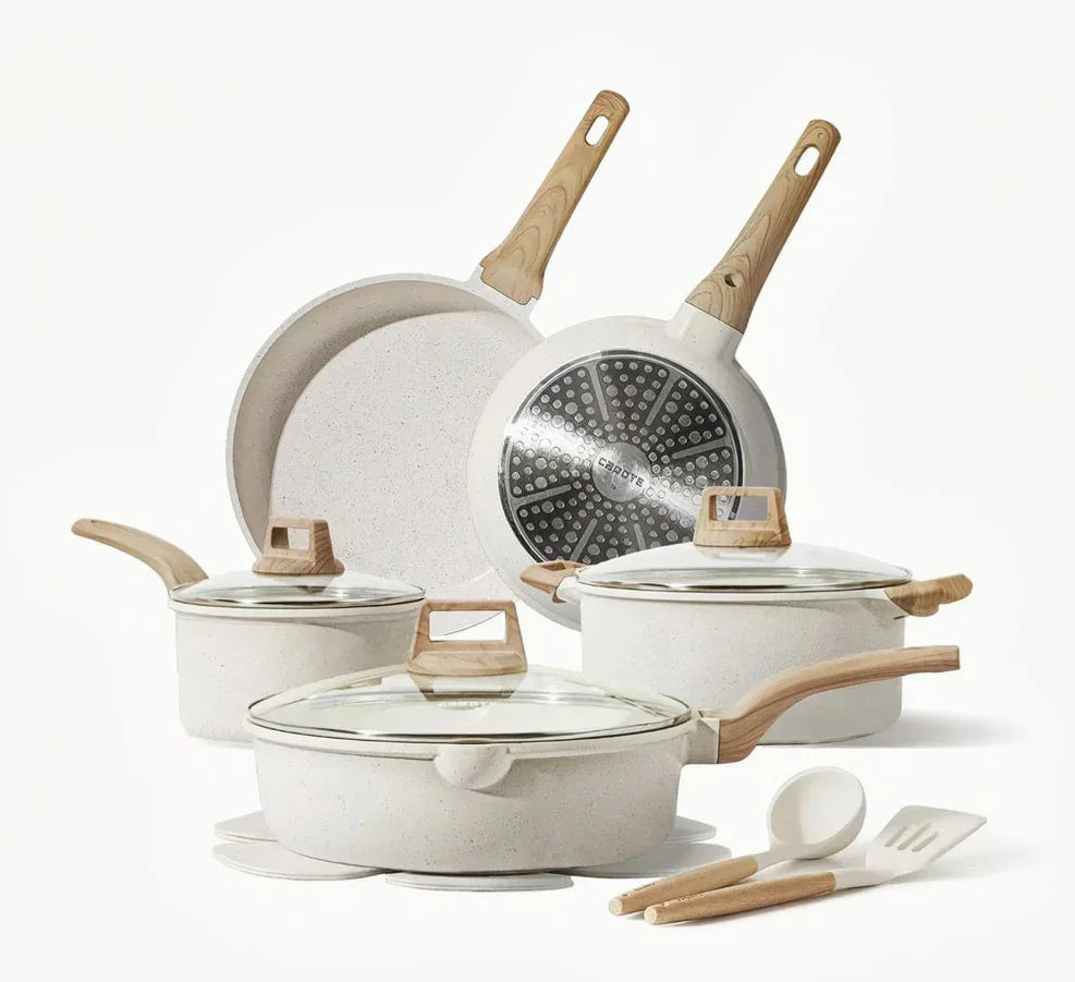 Nonstick white cookware set with wooden handles, glass lids, and kitchen utensils