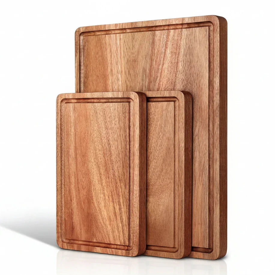 Set of three wooden cutting boards with juice grooves, ideal for kitchen prep and food prep tasks.