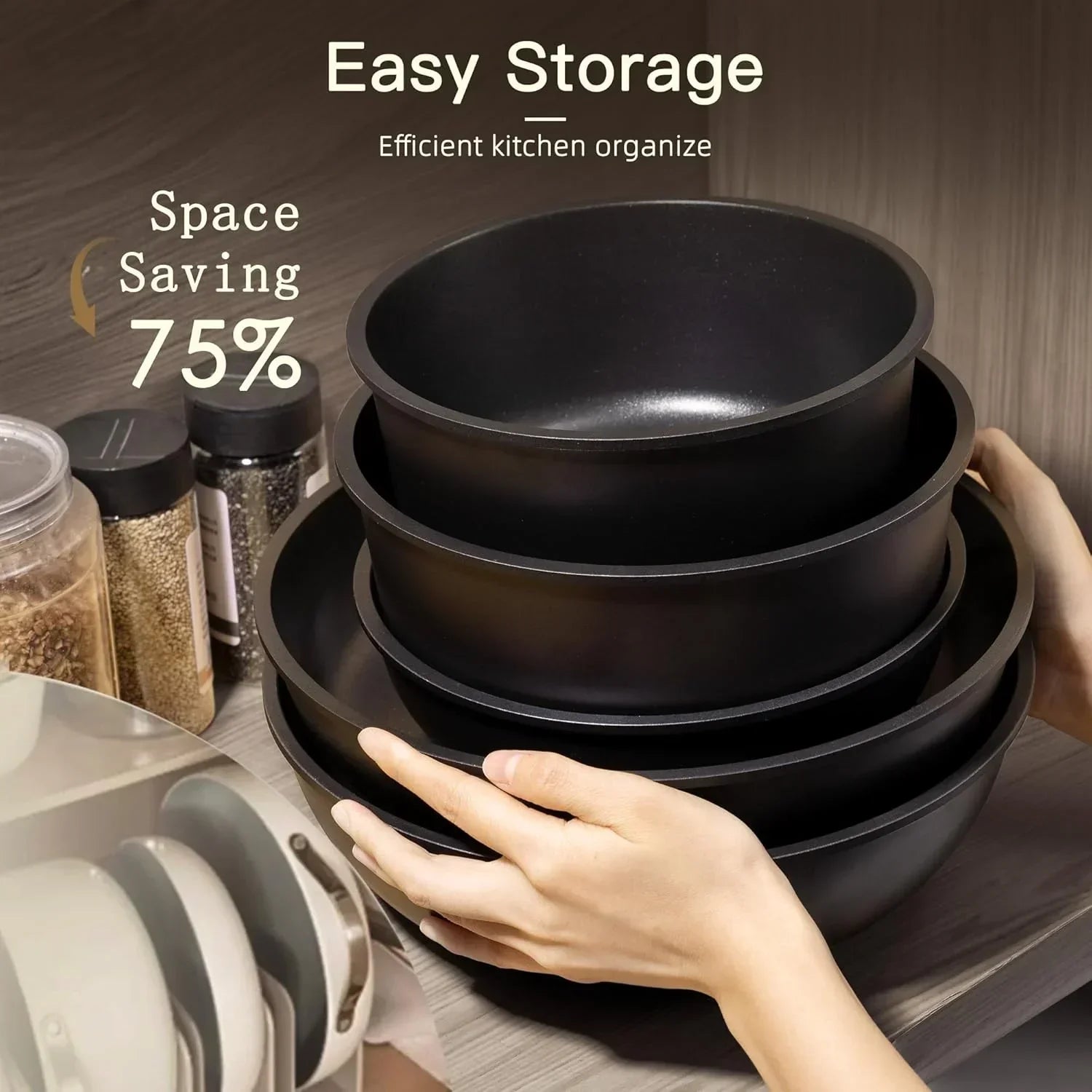 Nested black mixing bowls for space-saving kitchen storage beside spice jars
