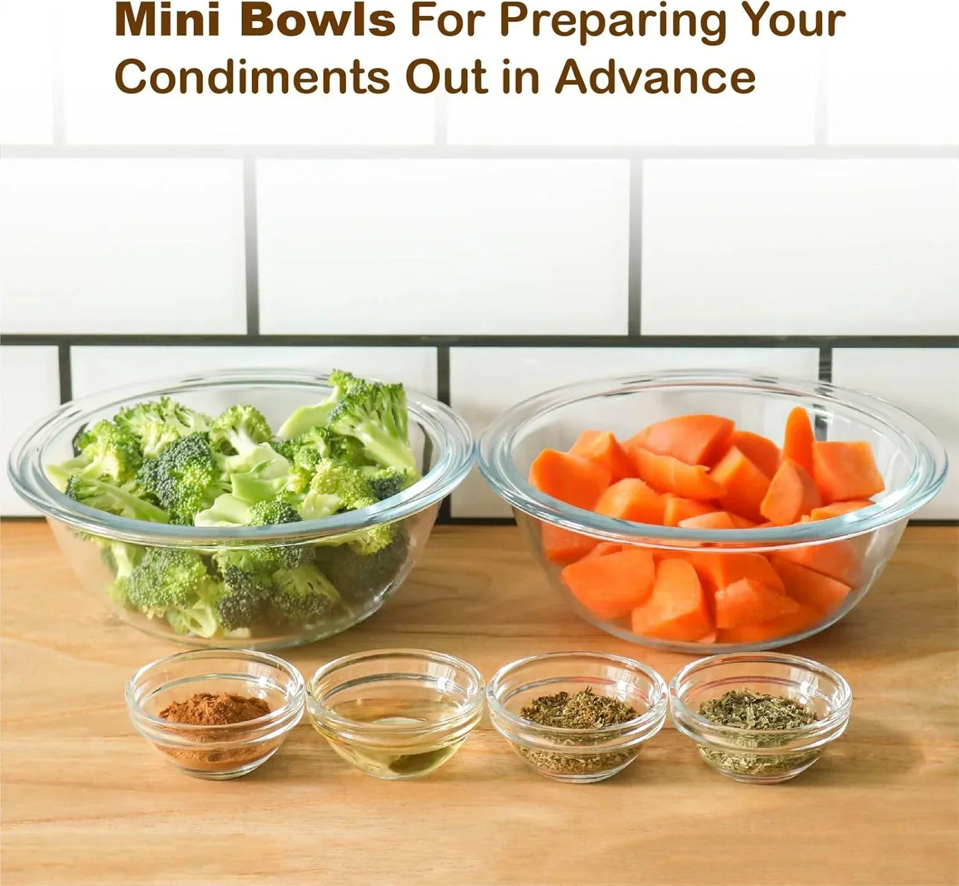 Glass mini bowls with chopped broccoli, carrots, and spices for meal prep on a wooden counter