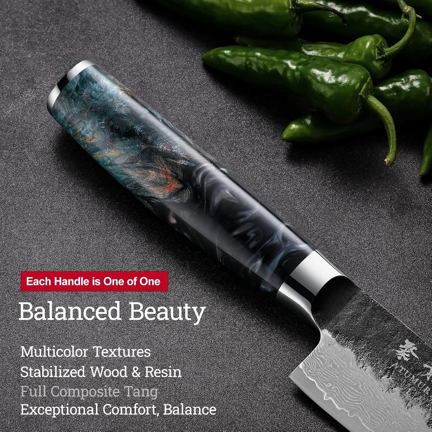 Japanese chef knife with multicolor stabilized wood and resin handle on dark surface with green peppers