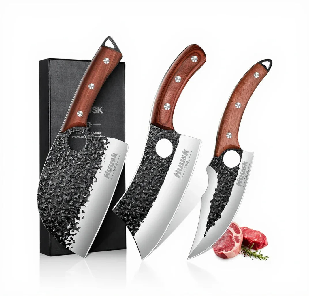 Set of three Japanese-style chef knives with hammered steel blades and wooden handles, displayed with a gift box and meat cuts.