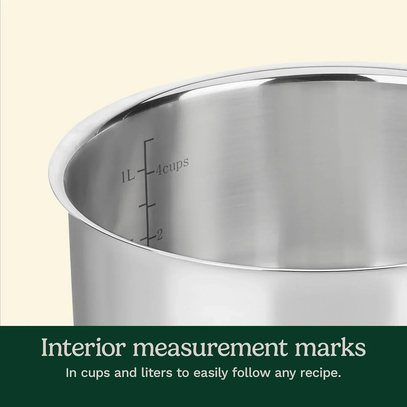 Stainless steel pot interior with measurement marks in cups and liters for precise cooking