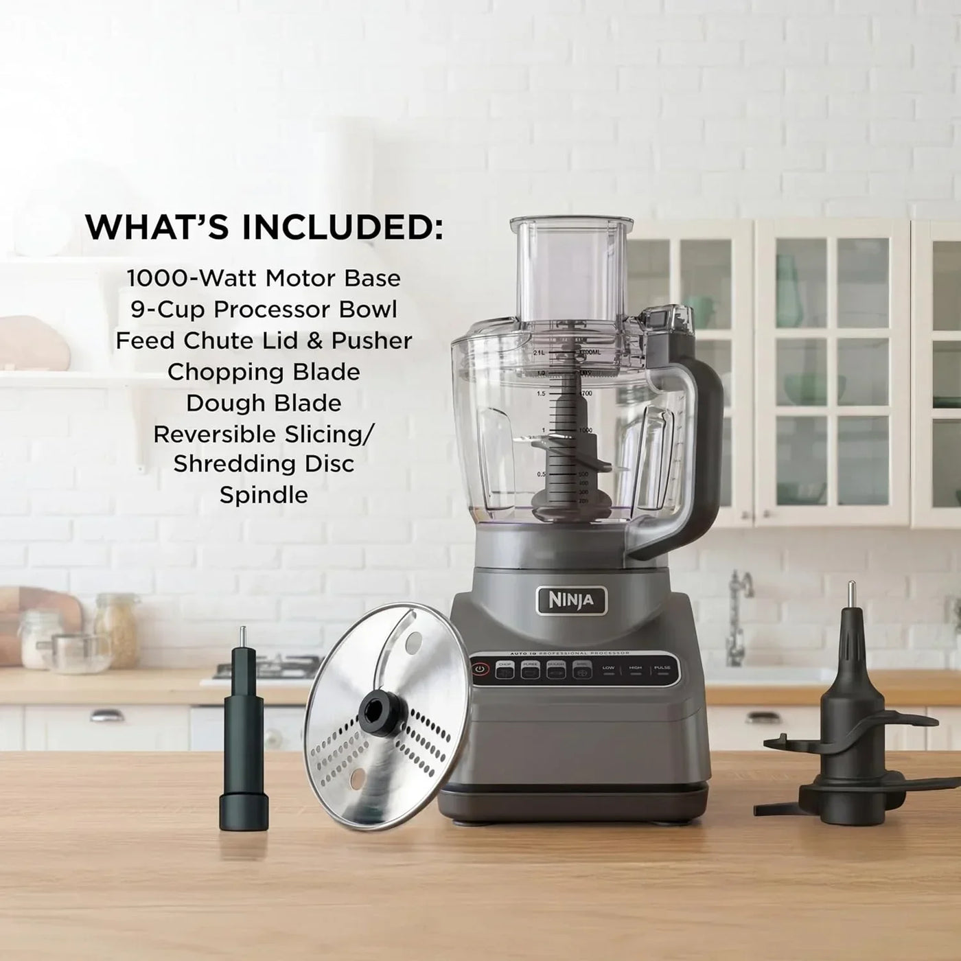 Ninja 1000-watt food processor with 9-cup bowl, slicing disc, and dough blade on kitchen counter