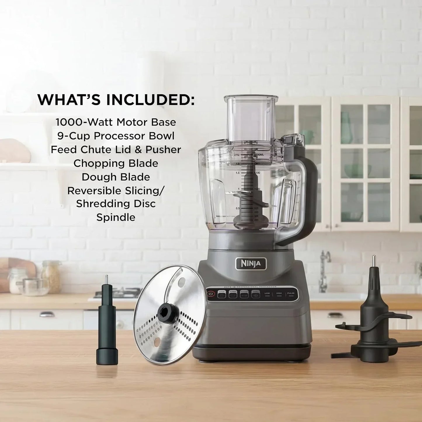 Ninja 1000-watt food processor with 9-cup bowl, slicing disc, and dough blade on kitchen counter