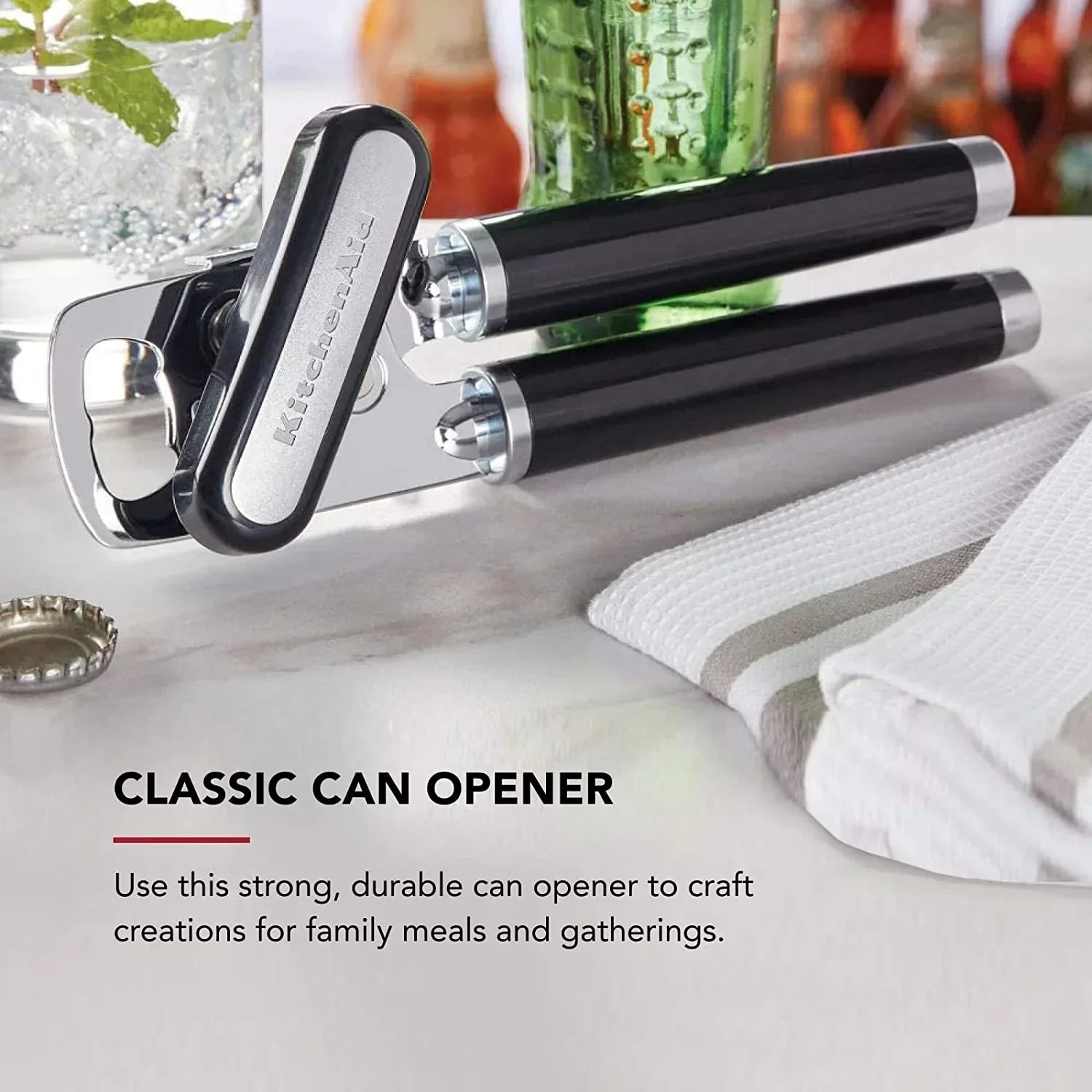 KitchenAid classic can opener with black handle on marble countertop, kitchen tools for family meals