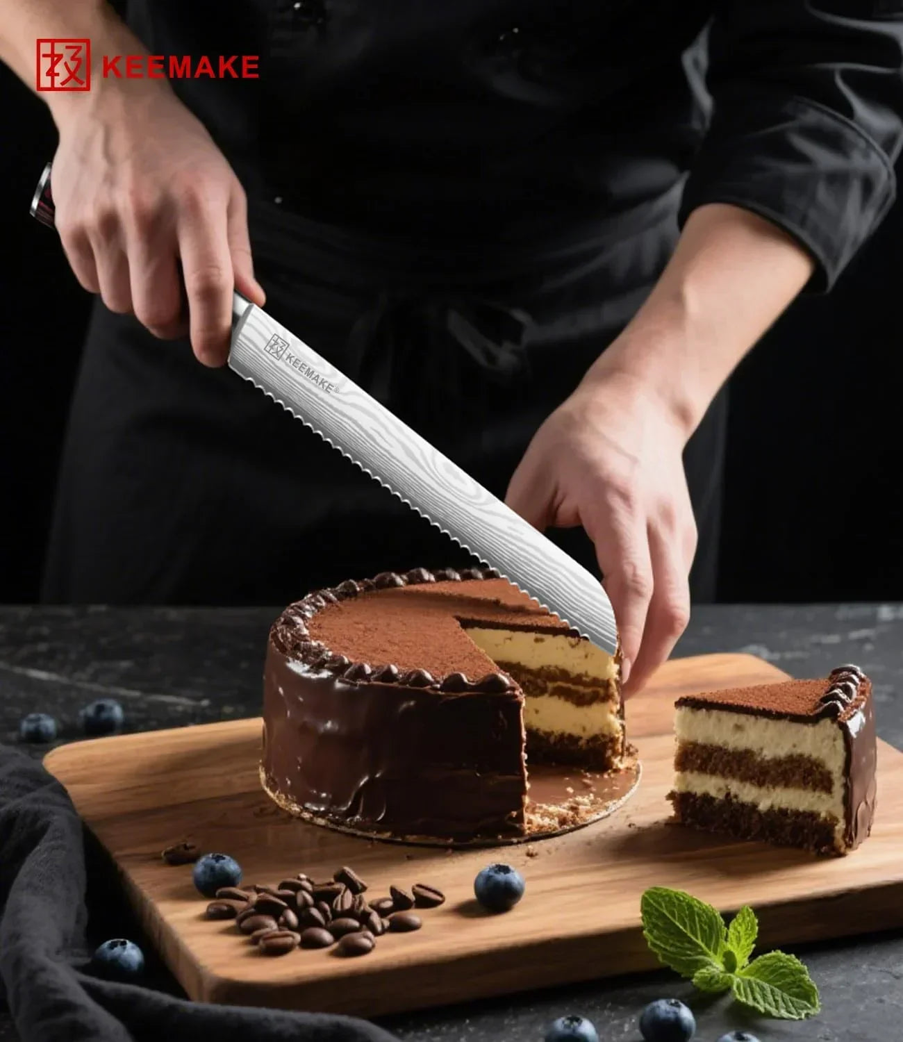 Slicing chocolate cake with KEEMAKE serrated knife on wooden board with blueberries and mint