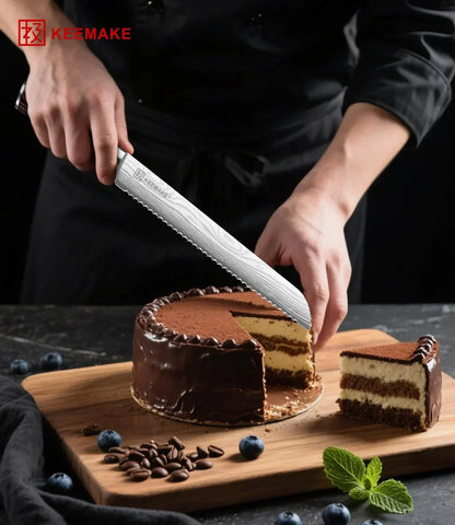 Slicing chocolate cake with KEEMAKE serrated knife on wooden board with blueberries and mint