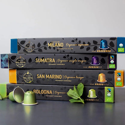 Organic Nespresso-compatible coffee pods: Milano, Sumatra, San Marino, Bologna flavors with mint garnish