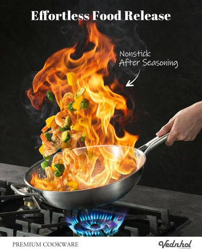 Nonstick frying pan with shrimp and veggies flipping over flames, effortless food release on gas stove