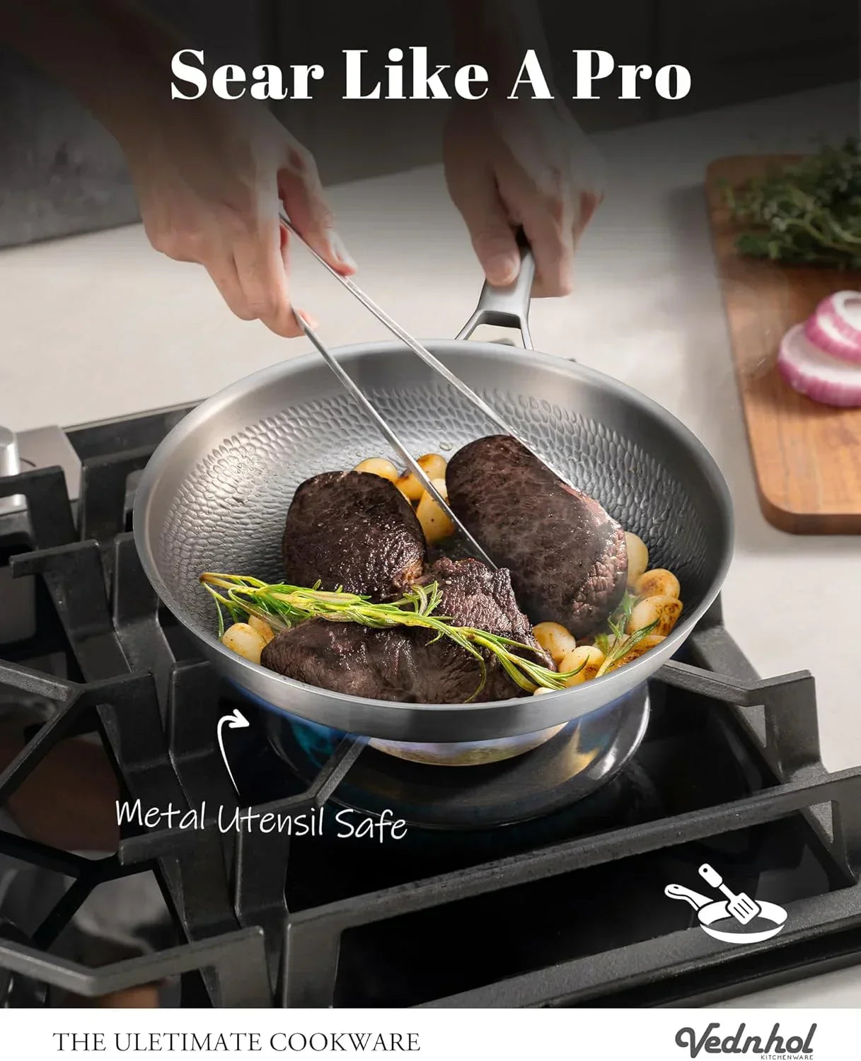 Searing steak in a metal utensil safe frying pan on gas stove with rosemary and garlic