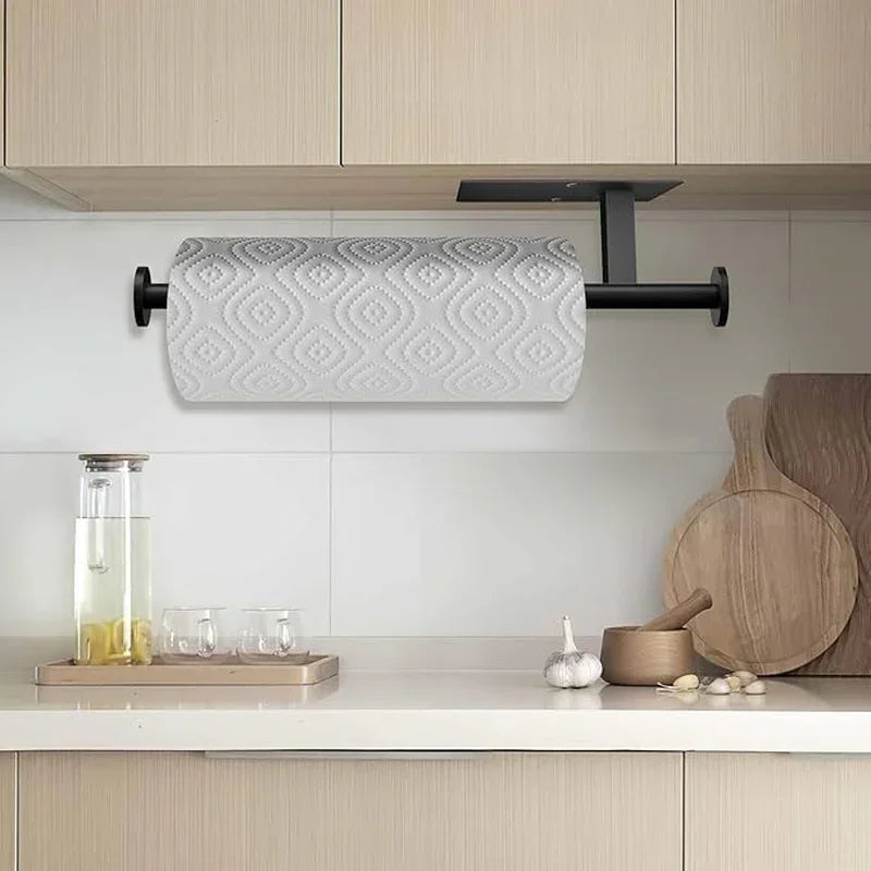 Black under-cabinet paper towel holder with patterned roll, modern kitchen countertop setup