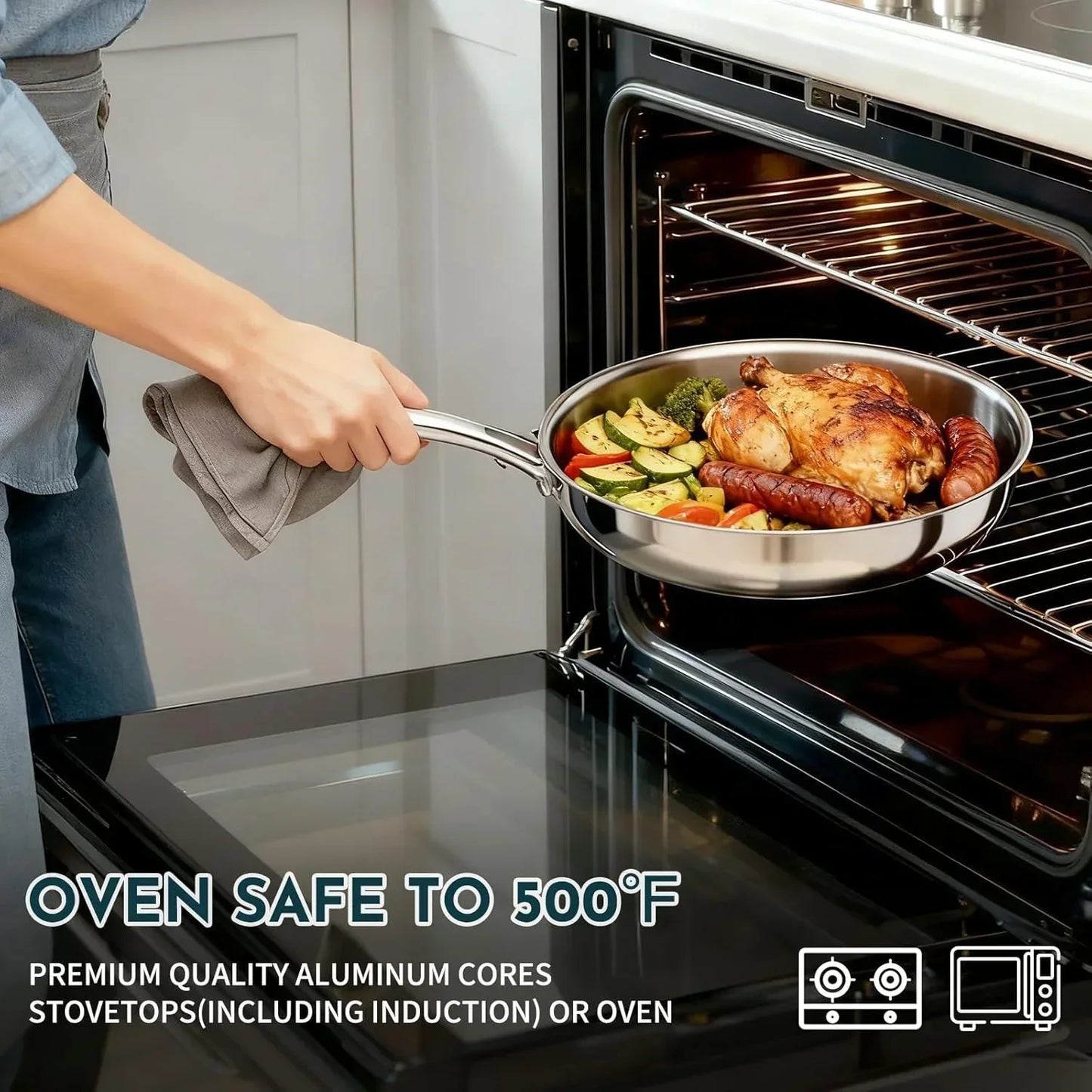 Oven-safe stainless steel skillet with roasted chicken, veggies, and sausages being removed from oven