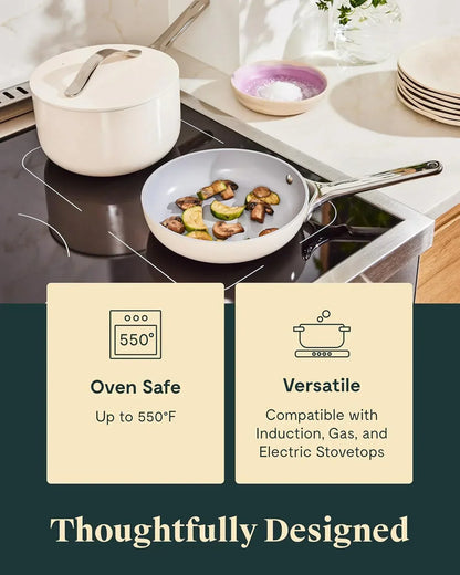 White saucepan with lid and nonstick frying pan on induction cooktop, oven safe, versatile cookware
