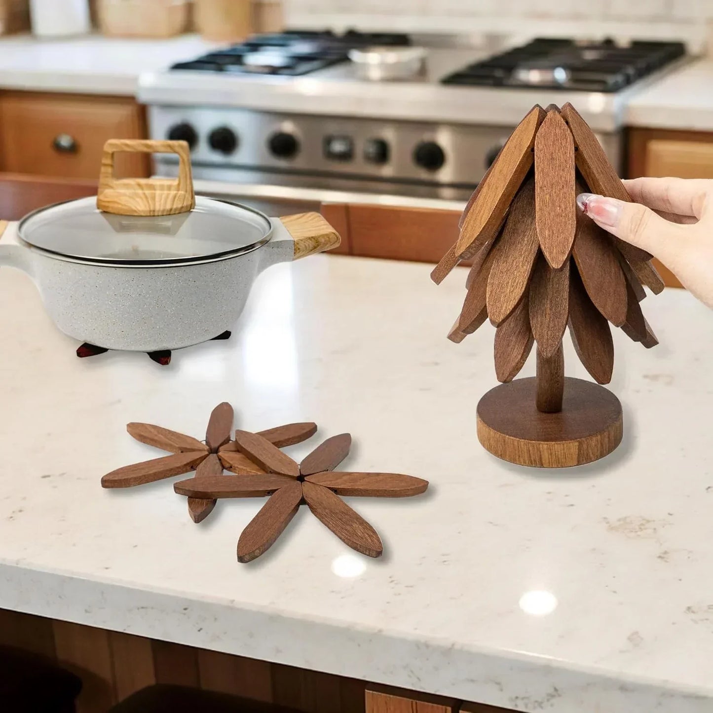 Wooden tree-shaped trivet and flower coasters on kitchen counter with pot, perfect for cookware protection and kitchen decor