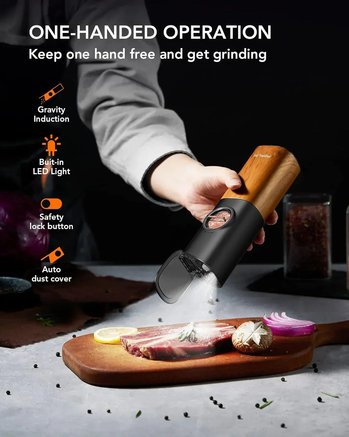One-handed electric spice grinder with LED light grinding pepper over steak on wooden board