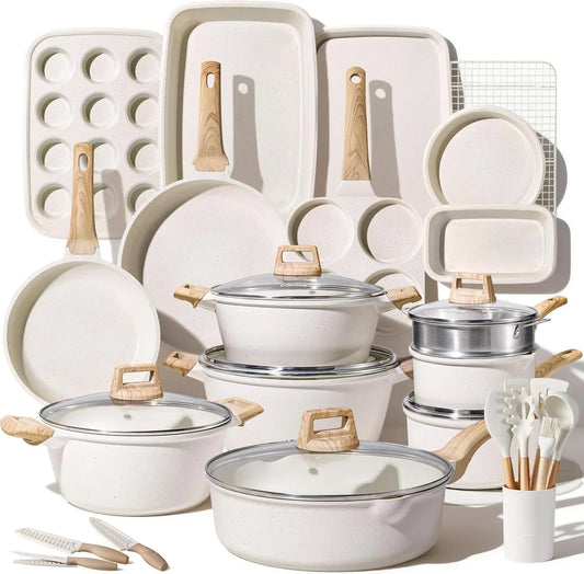 Cream speckled cookware set with wooden handles, baking trays, pots, pans, and kitchen tools for everyday cooking