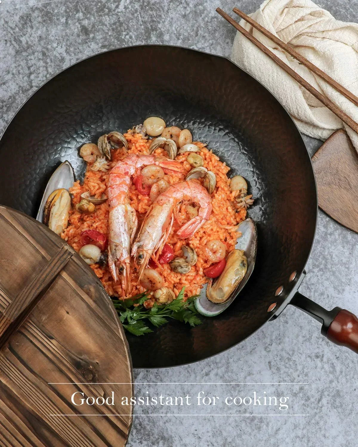 Seafood paella in black wok with shrimp, mussels, and clams, ideal for home cooking and kitchen routines