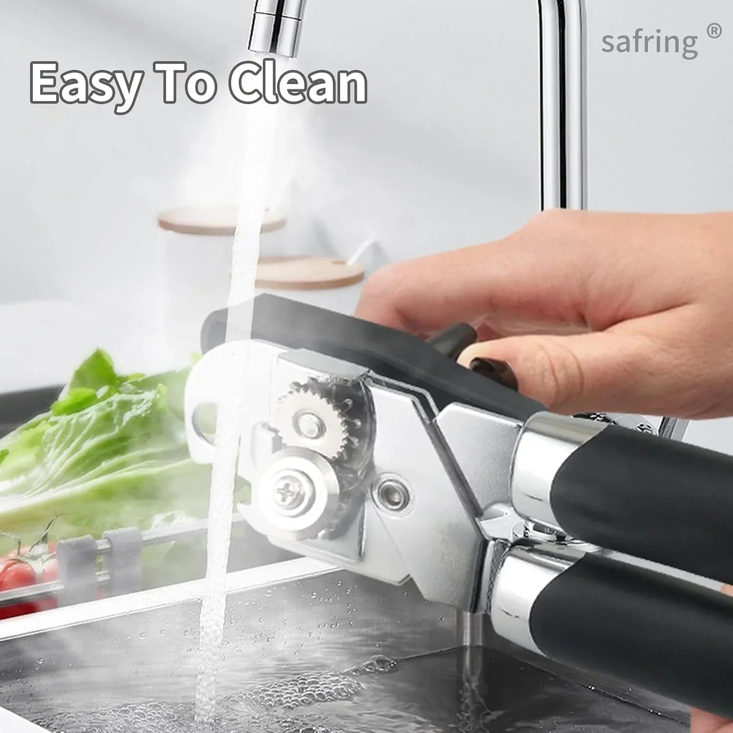 Easy to clean stainless steel garlic press under running water in kitchen sink with fresh veggies