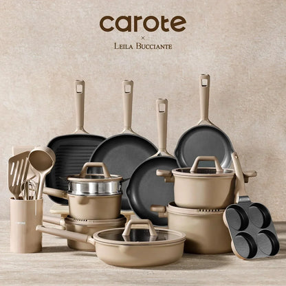Beige nonstick cookware and utensil set with pots, pans, lids, and kitchen tools on a countertop.