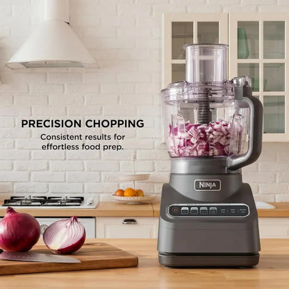 Ninja food processor chopping red onions for precision meal prep in a modern kitchen