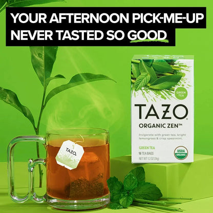 Tazo Organic Zen green tea bag steeping in glass mug with fresh mint, USDA Organic certified box nearby