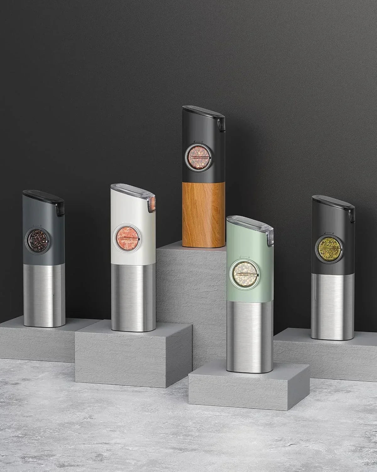 Modern electric salt and pepper grinders in stainless steel and wood, kitchen essentials for seasoning