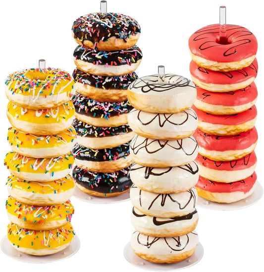 Colorful donuts with sprinkles and icing stacked on display stands for kitchen serving