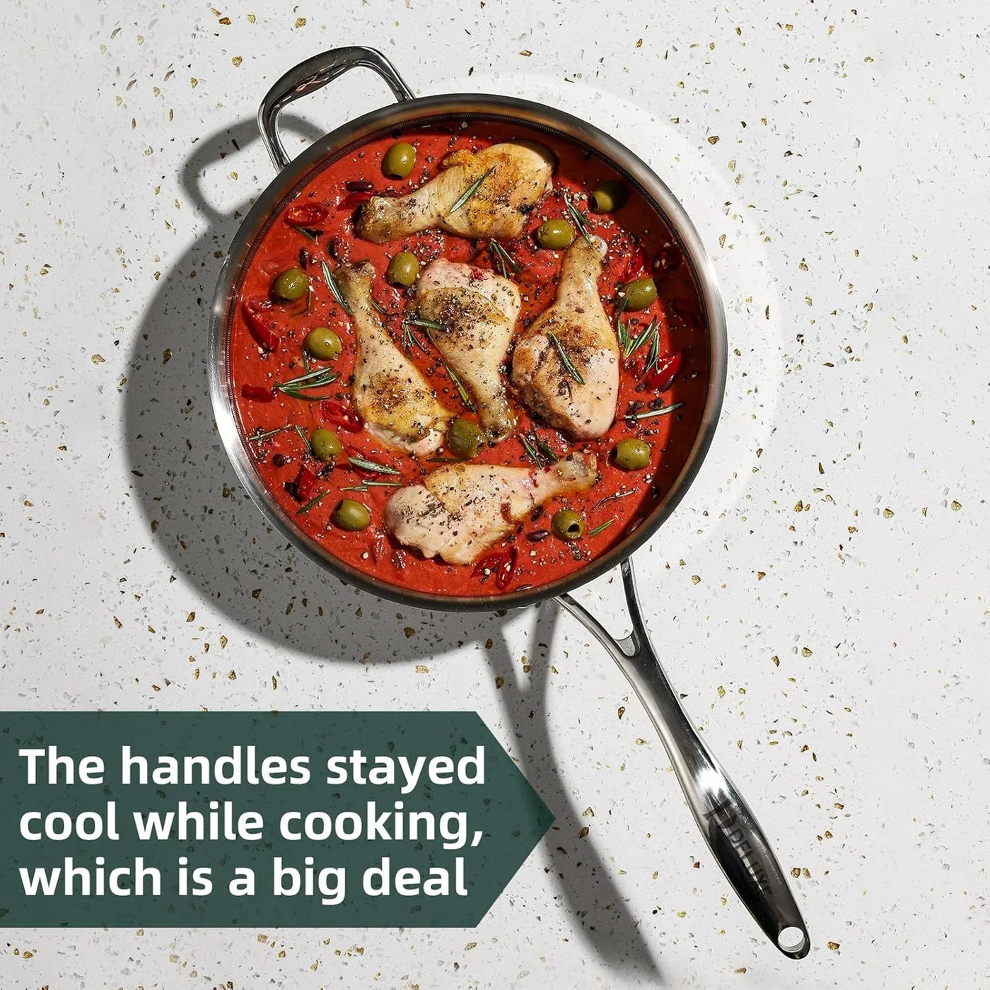 Stainless steel skillet with chicken, olives, and rosemary in tomato sauce, cool-touch handles