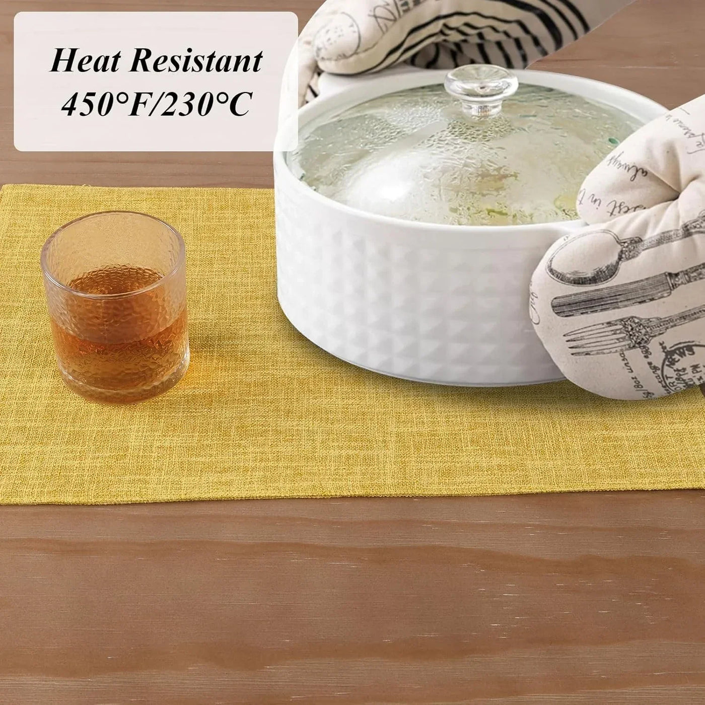 Heat-resistant yellow placemat under hot casserole dish, kitchen table setting with glass