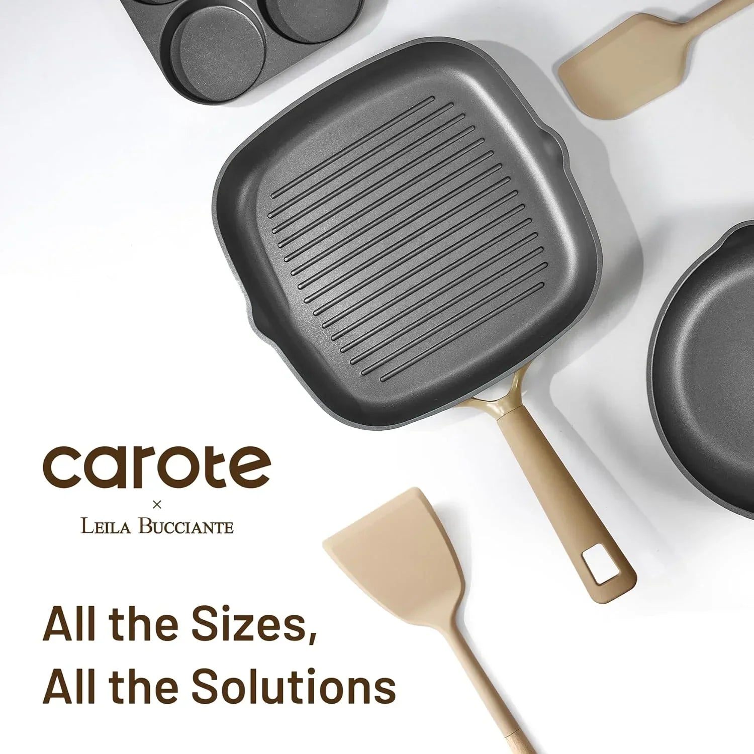 Nonstick grill pan, round skillet, muffin pan, and beige spatulas on white kitchen background.