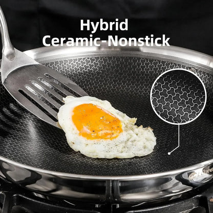 Hybrid ceramic nonstick frying pan cooking sunny-side-up egg with spatula, honeycomb surface detail