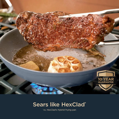 Searing steak in nonstick frying pan with garlic and butter, gas stove cooking