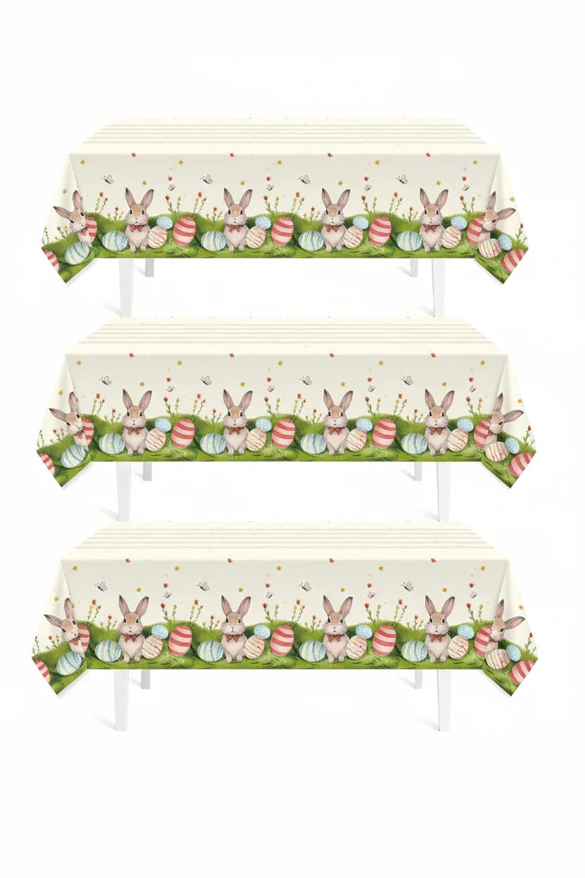 Easter tablecloth with bunnies and colorful eggs on green grass, perfect for spring gatherings and festive dining.
