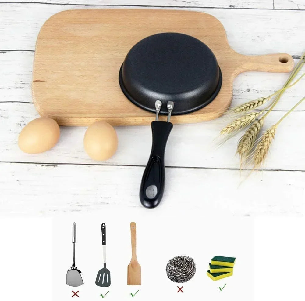 Nonstick frying pan on wooden cutting board with eggs, wheat, and utensil care icons for kitchen cooking tools