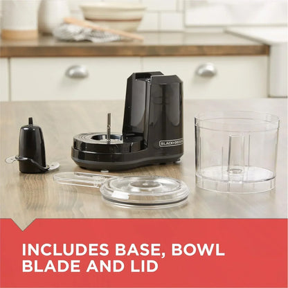 Black+Decker mini food processor with base, clear bowl, blade, and lid on kitchen counter