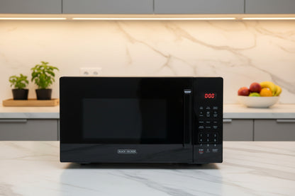 Black countertop microwave oven with digital control panel and keypad